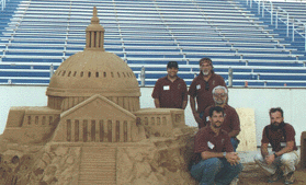 Sculptor/Instructors with the Capital of the City